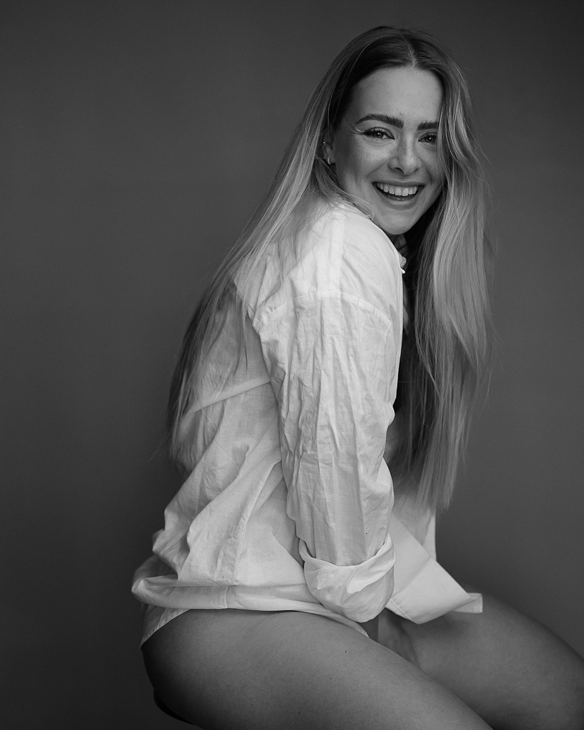 Black and white oach's image in white shirt.